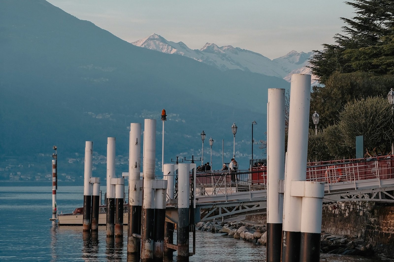 Ferry landing and waterfront at Menaggio with Lake Como and mountains behind it
